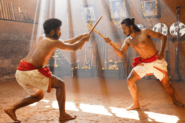 Men practicing Kalaripayattu in a Kalari in Kerala