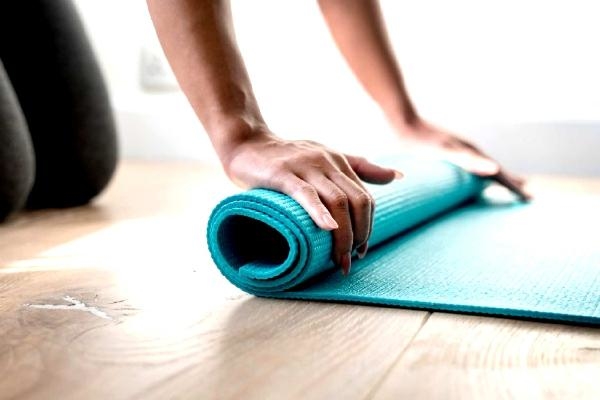Unrolling Yoga mat and getting ready for Online Yoga